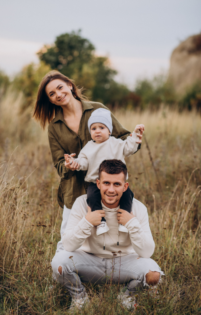 portrait of family in rice terrace bali with their baby in happy expression